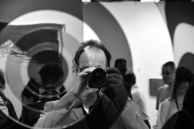 Young woman photographing through camera