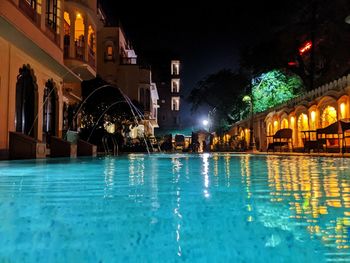 View of swimming pool at night