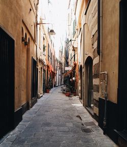 Narrow alley amidst buildings in city