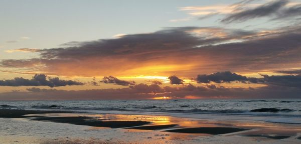 Scenic view of sea against sky during sunset