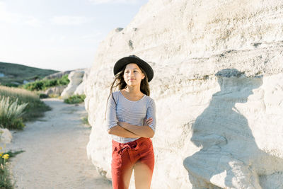 Girl wearing hat looking away