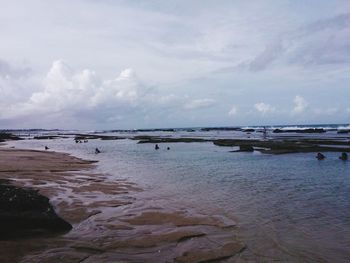 Scenic view of sea against cloudy sky