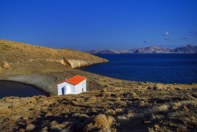 Scenic view of sea and buildings against sky