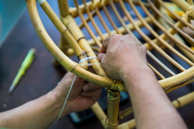 Close-up of man working on metal