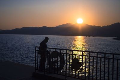 Silhouette of people at sunset