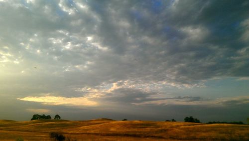 Scenic view of landscape against cloudy sky