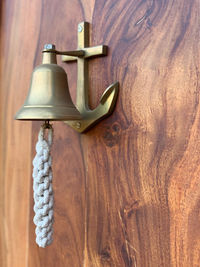 Close-up of electric lamp hanging on table