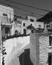 Buildings in city against clear sky