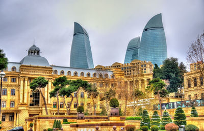 Buildings in city against sky