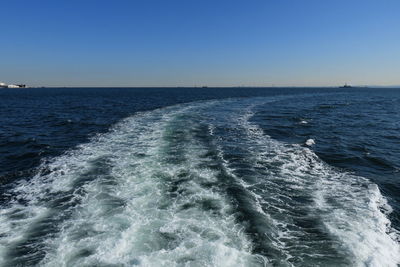 Scenic view of sea against clear blue sky