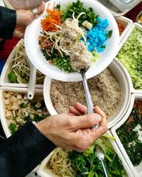 High angle view of man holding food