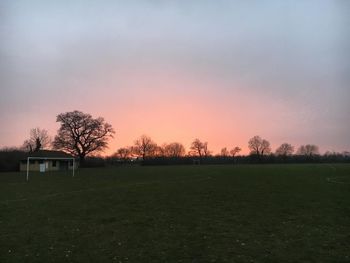 Scenic view of field against sky during sunset