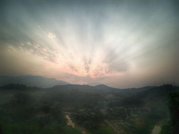 Scenic view of landscape against sky during sunset