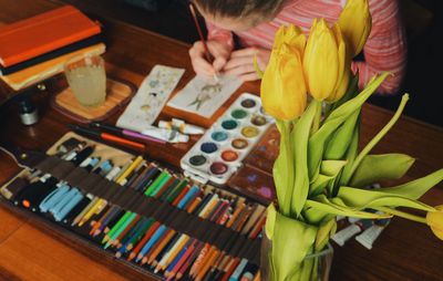 High angle view of woman painting easter bunny