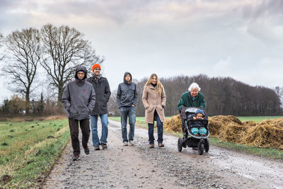 Family walking on road