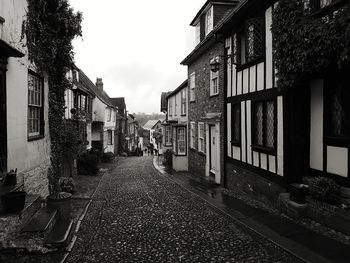Empty alley amidst buildings in city