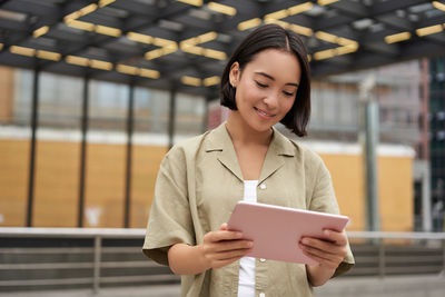 Young woman using mobile phone