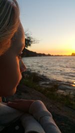 Cropped image of woman looking at sea