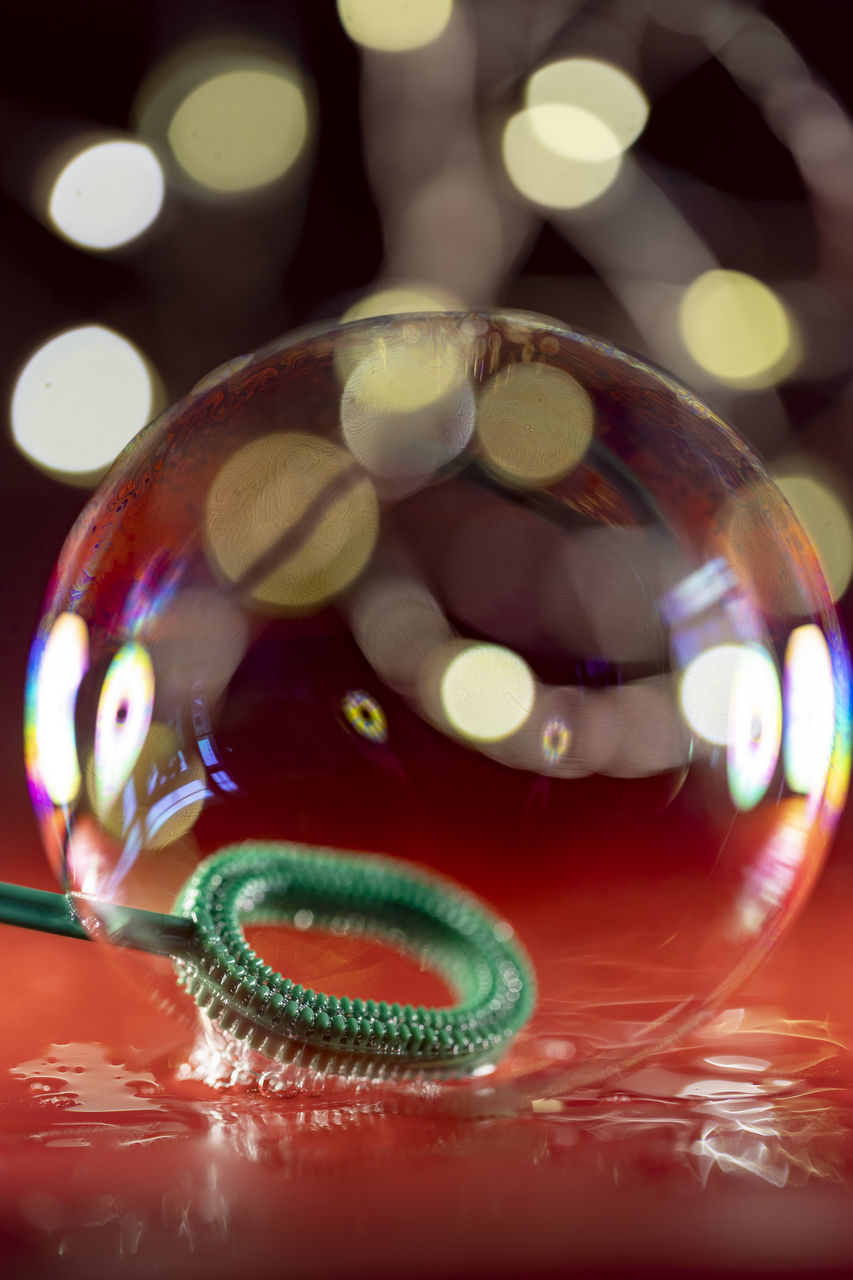 no people, sphere, close-up, multi colored, macro photography, holiday, indoors, celebration, glass, decoration, light, illuminated, animal, shiny, christmas