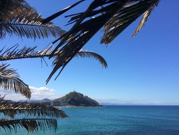 Scenic view of sea against blue sky