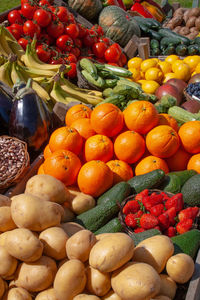 Beautiful composition of various fresh and ripe biological vegetables and fruits in wooden boxes