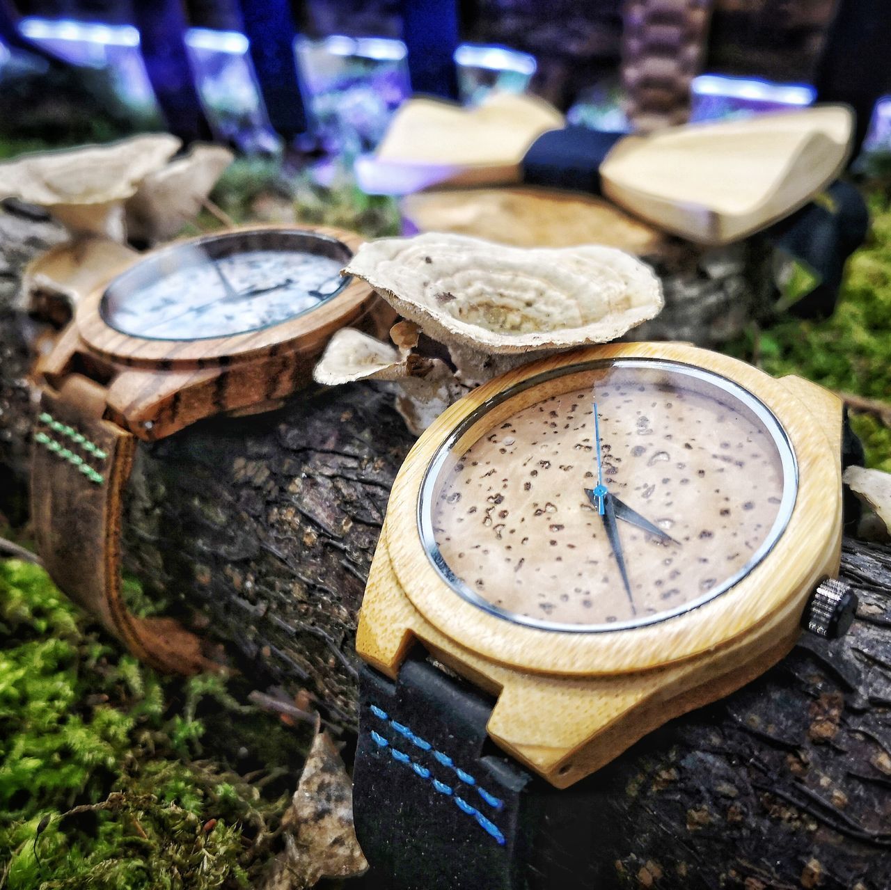 CLOSE-UP OF CLOCK ON MESSY TABLE