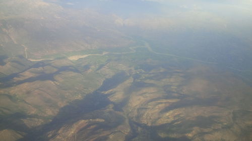Aerial view of a river in foggy weather