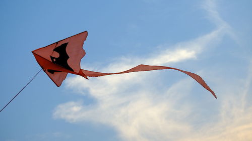 Low angle view of flags hanging against sky