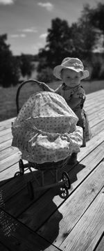 Cute girl with toy toys on wood