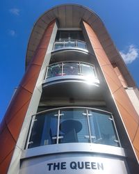 Low angle view of communications tower against sky