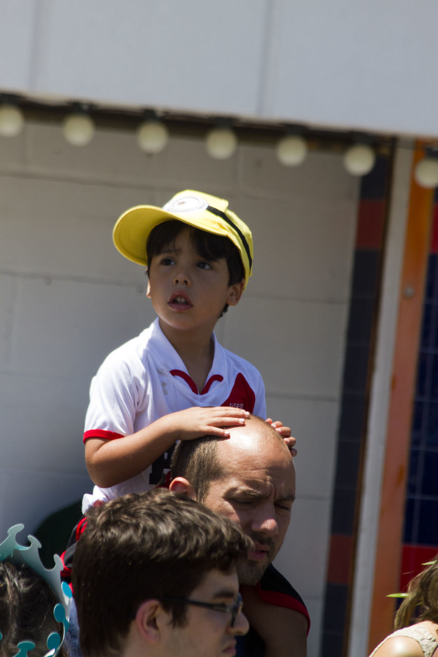 males, men, boys, child, childhood, real people, lifestyles, leisure activity, hat, portrait, casual clothing, people, togetherness, day, incidental people, focus on foreground, front view, bonding, outdoors, innocence, son