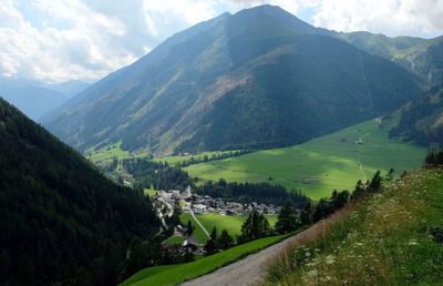 Scenic view of landscape and mountains against sky