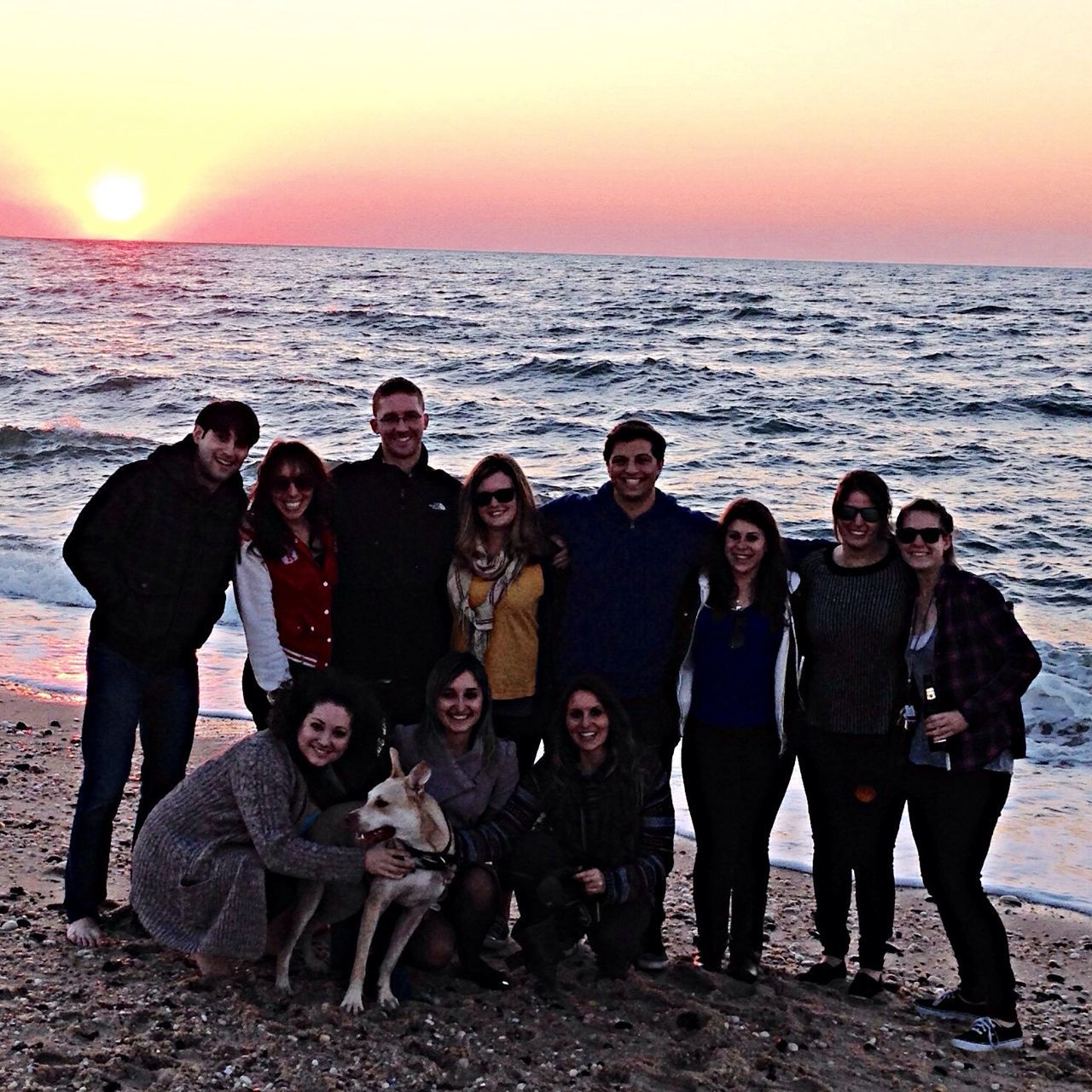 sea, horizon over water, togetherness, sunset, water, beach, lifestyles, leisure activity, sun, bonding, shore, love, vacations, friendship, sky, men, beauty in nature, orange color