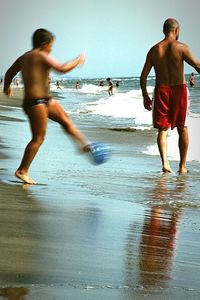 Boy jumping in sea