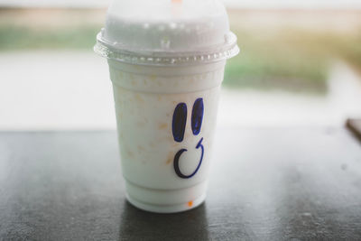 Close-up of coffee cup on table