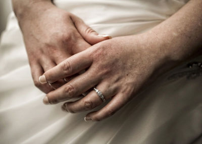 Midsection of woman wearing finger ring