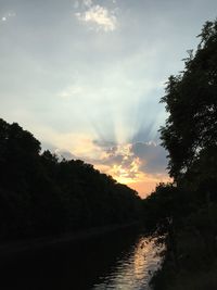 Scenic view of river at sunset