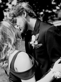 Portrait of couple kissing outdoors