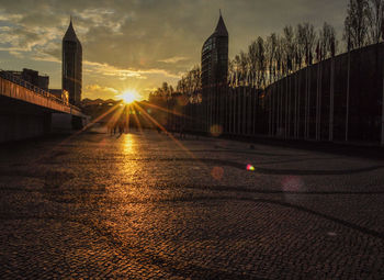 Buildings against sky at sunset