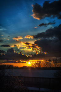 Scenic view of landscape against cloudy sky