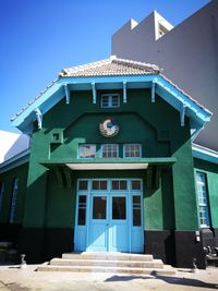 Low angle view of building against blue sky