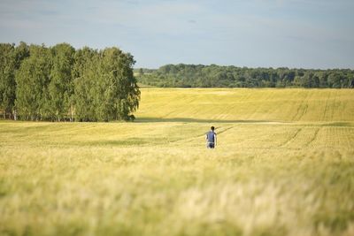 Full length of man on field against sky