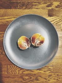 High angle view of fruits in plate on table