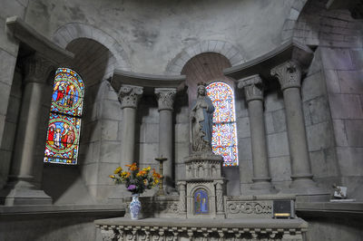 Low angle view of stained glass window in temple