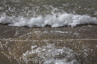 Close-up of waves splashing in sea