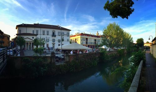 Buildings against blue sky and clouds