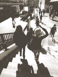 People walking on street in city