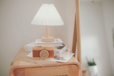 Close-up of electric lamp on table