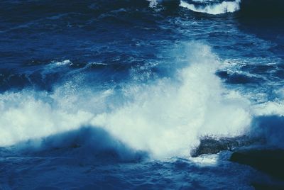 Waves splashing on rocks