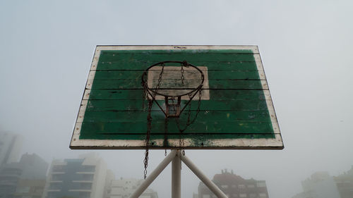 Low angle view of basketball hoop against sky